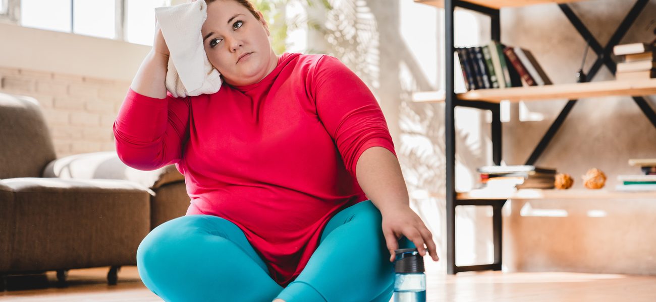 tired-exhausted-young-caucasian-fat-woman-sitting-relaxing-after-hard-training-home